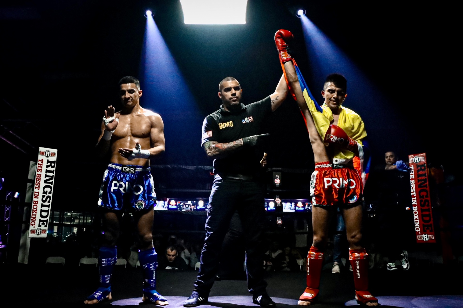 Referee raising the winner's arm — WMO USA Fight Night